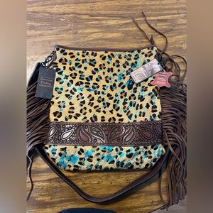 American Darling hand tooled leather purse with fringe.